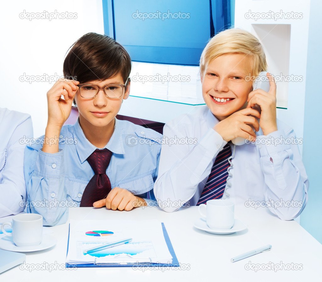 Two smart kids in the office