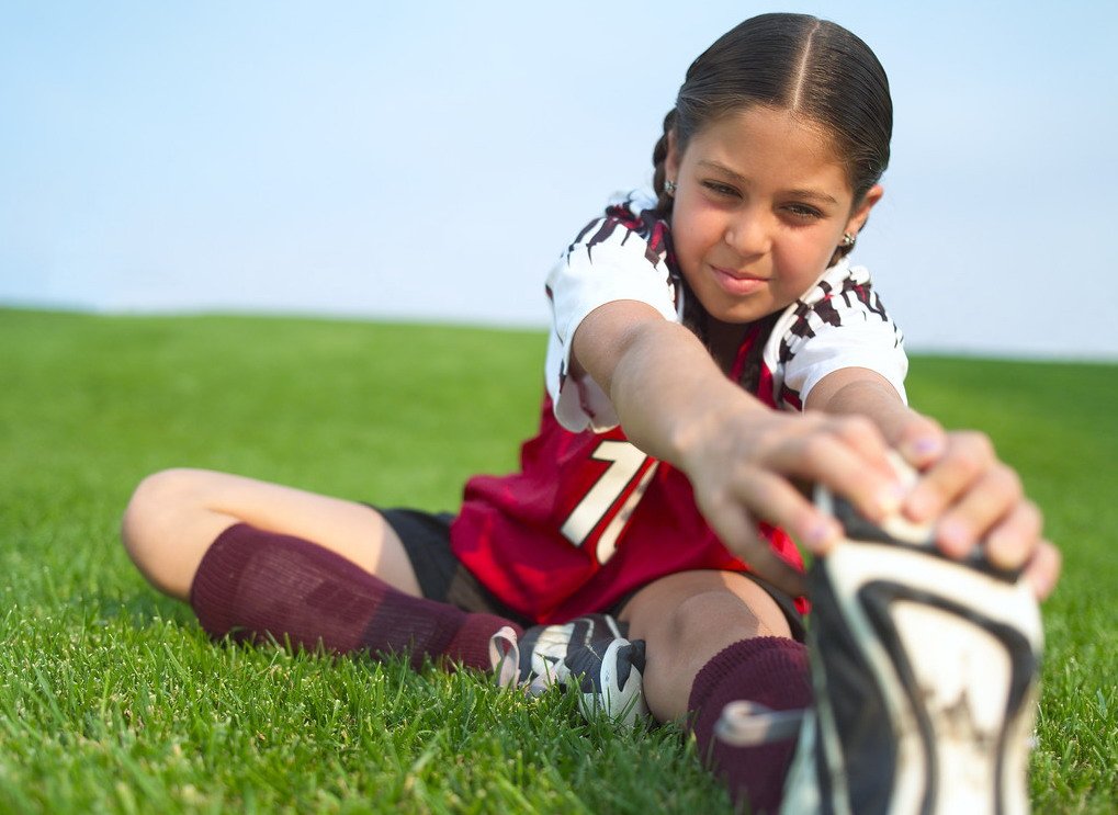 Little Soccer Player Stretching