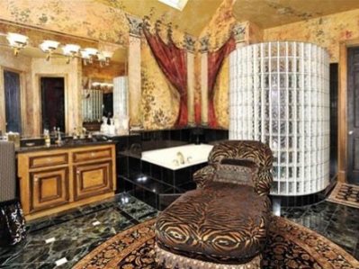 if-purple-was-a-color-of-doom-this-year-bathrooms-were-the-rooms-that-failed-the-most-this-one-with-gold-walls-faux-drapery-glass-bricks-and-an-animal-print-chair-sits-in-a-142-million-texas-listing